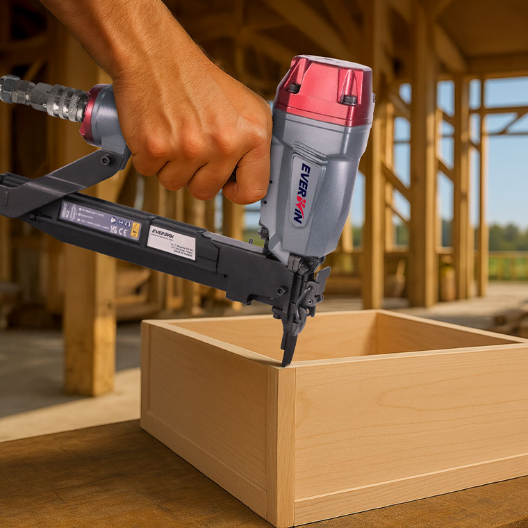 Using an EVERWIN pneumatic nailer to install vinyl siding on new home framing.